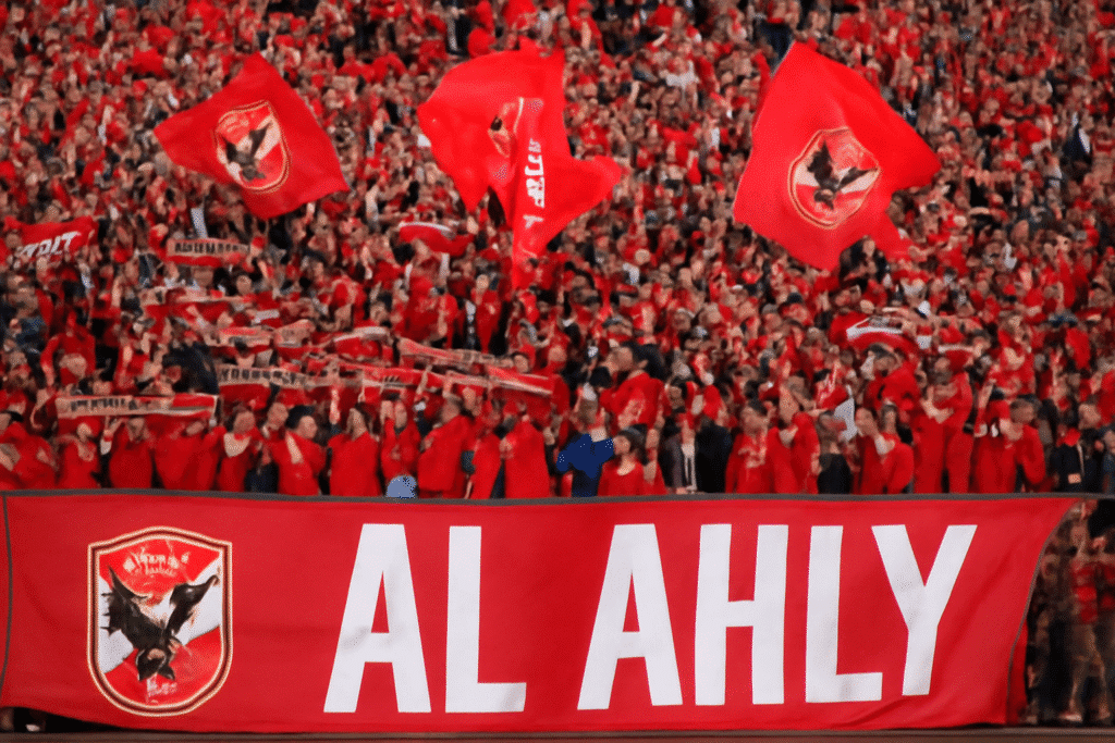 Al Ahly fans in the stadium, showcasing their passionate support for the club as the most successful African football team.